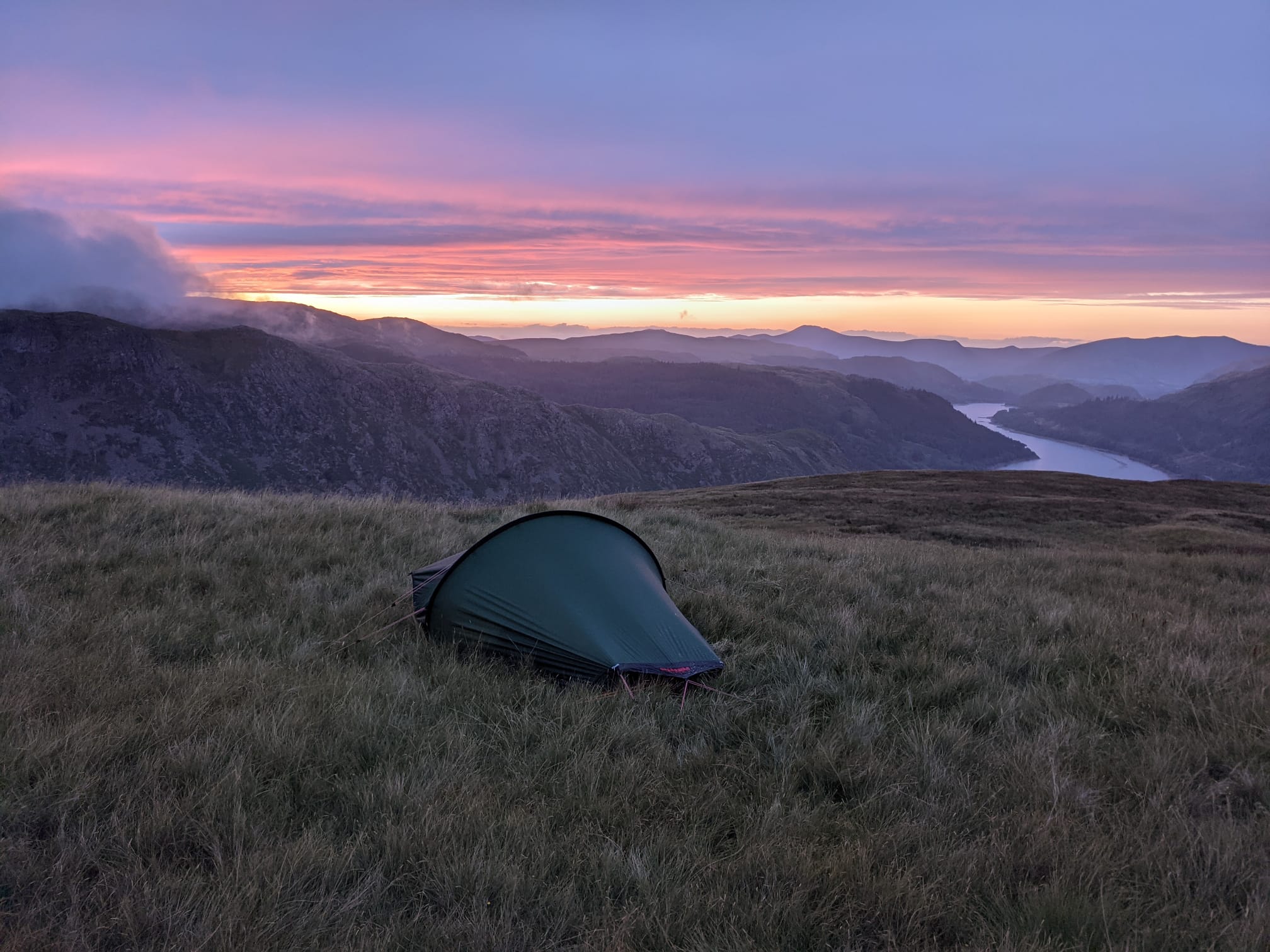 Wild camping tent at dusk